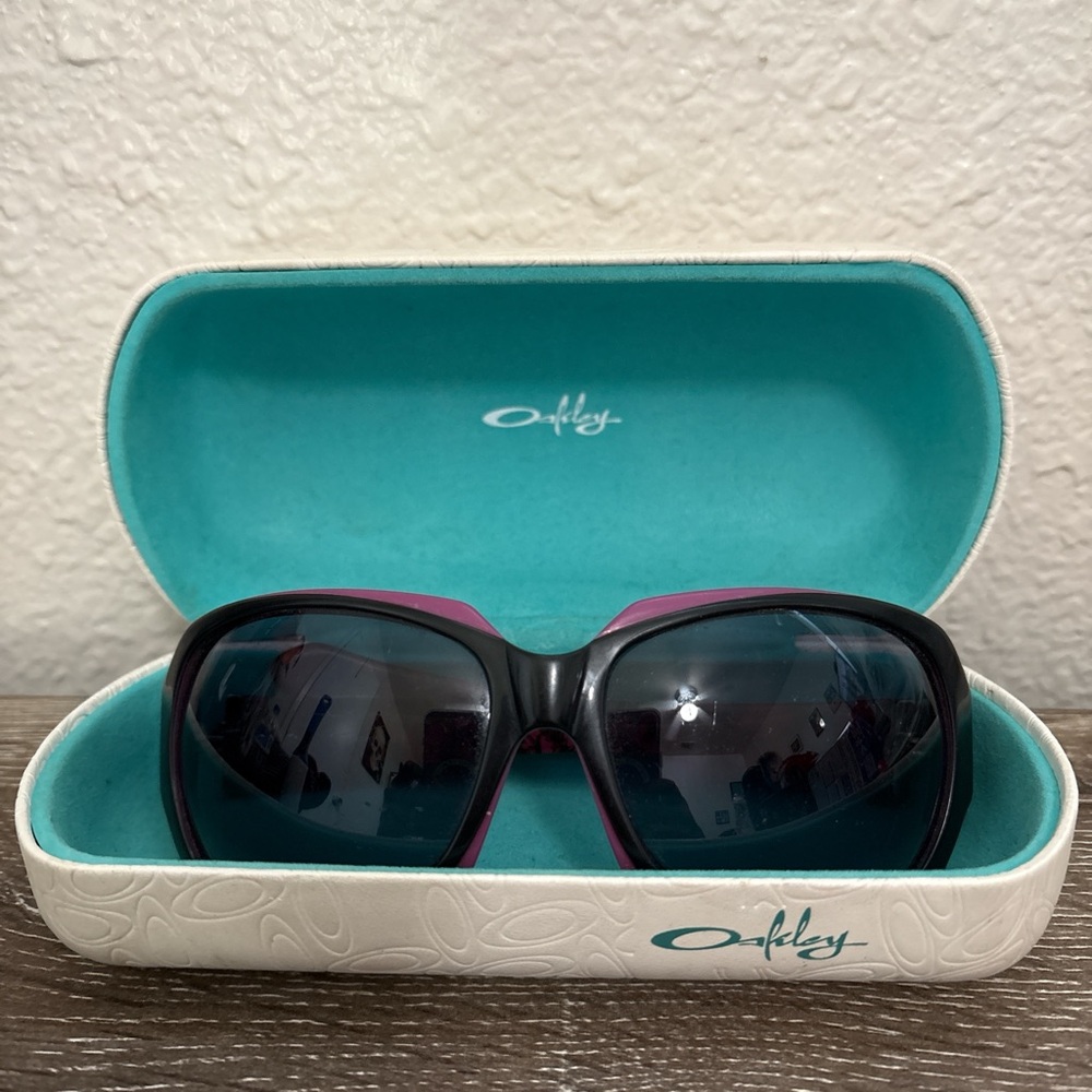 Oakley Women's Sunglasses with Black Frame and Pink Highlights